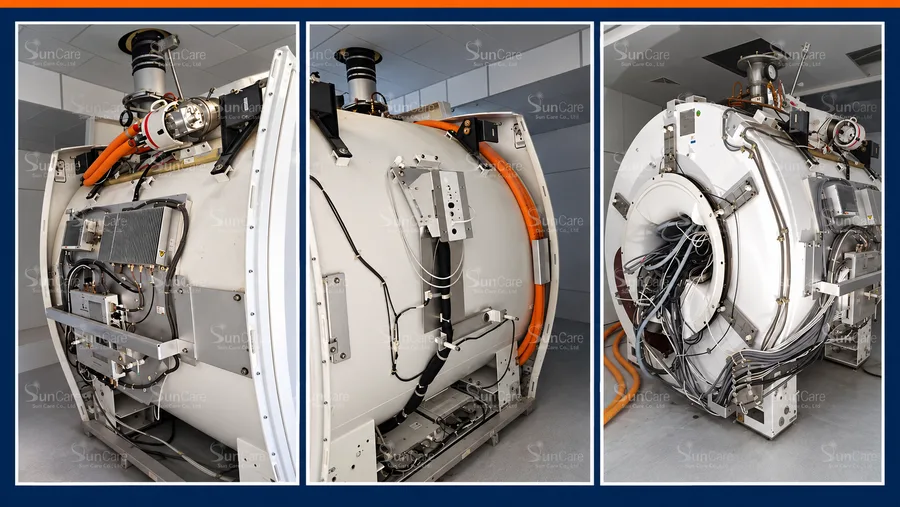 An MRI magnet with its covers removed, showing the cryogenic and service connections